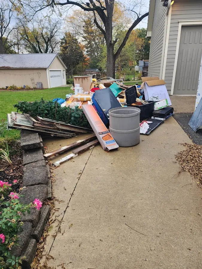 Dumpster being loaded with debris for Residential Dumpster Rental in Salem